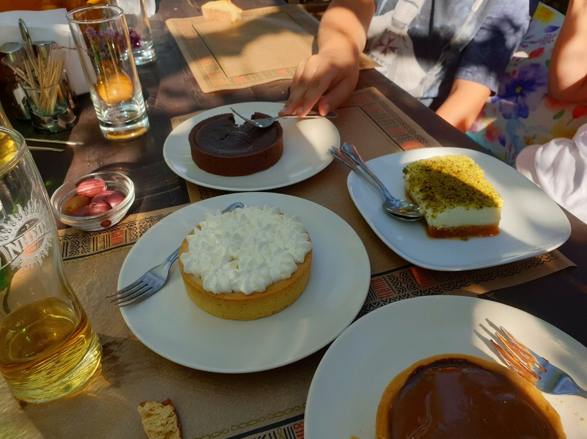 A table of handmade desserts at To Ktima